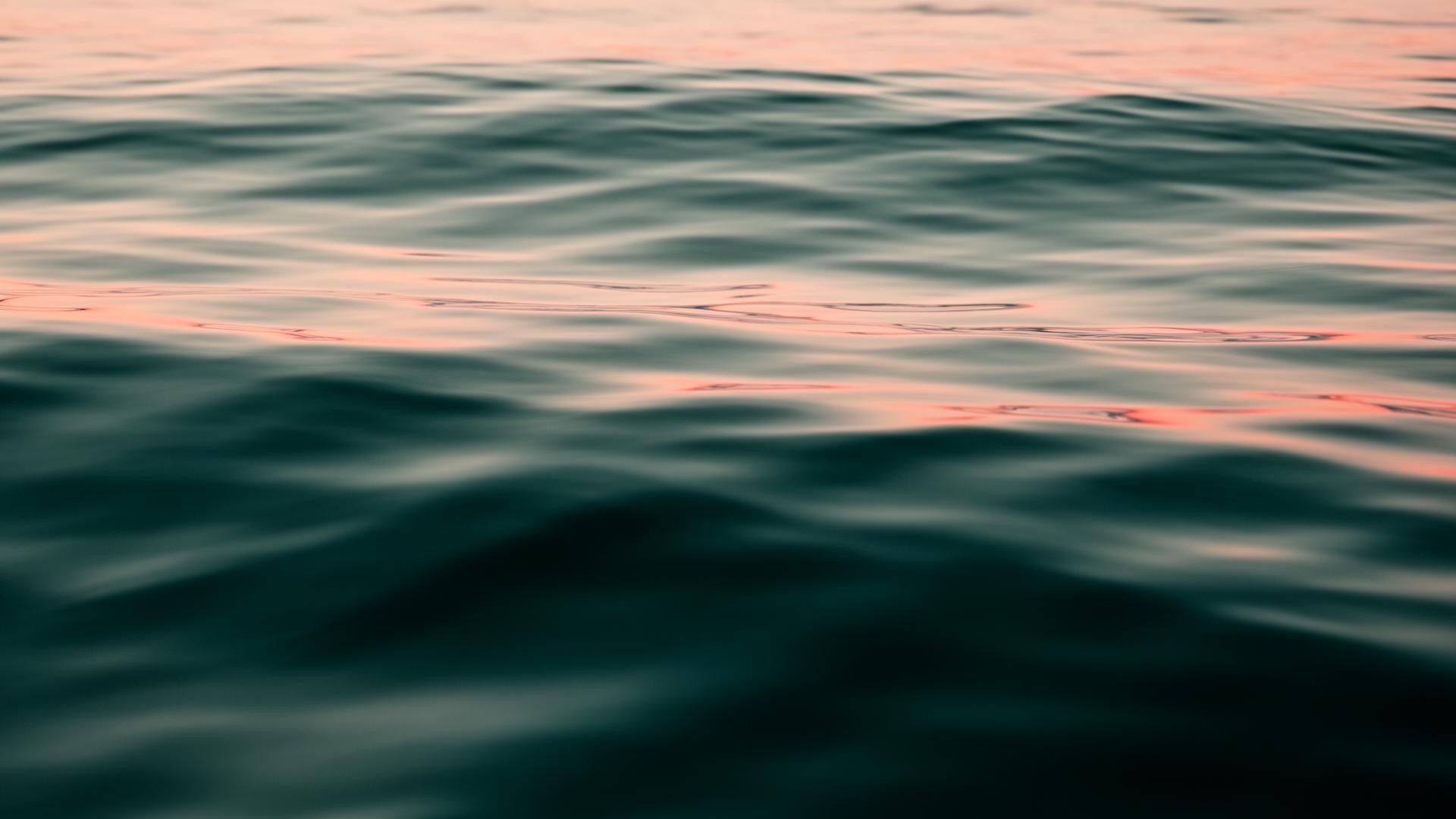 Calm ocean water at sunset